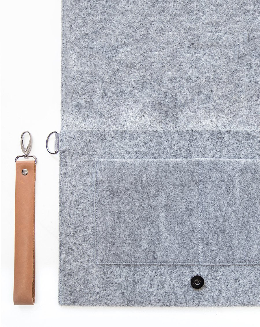 6. Interior view of Nordhale Berg 13'' grey laptop bag with open flap and removable wristband