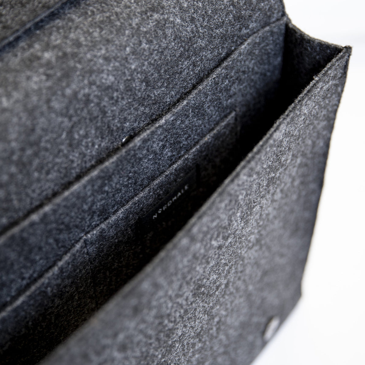 6. Interior view of Nordhale black briefcase Hjo, showing compartments and Nordhale branding