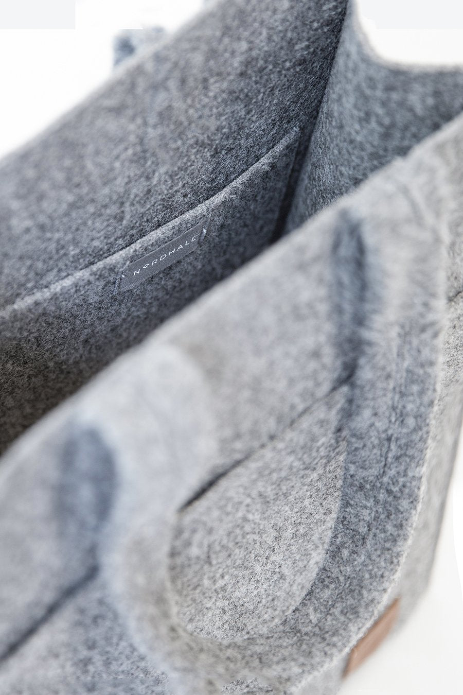 6. Close-up of Nordhale's grey Hof Tote Bag, featuring the inner laptop pocket and felt texture