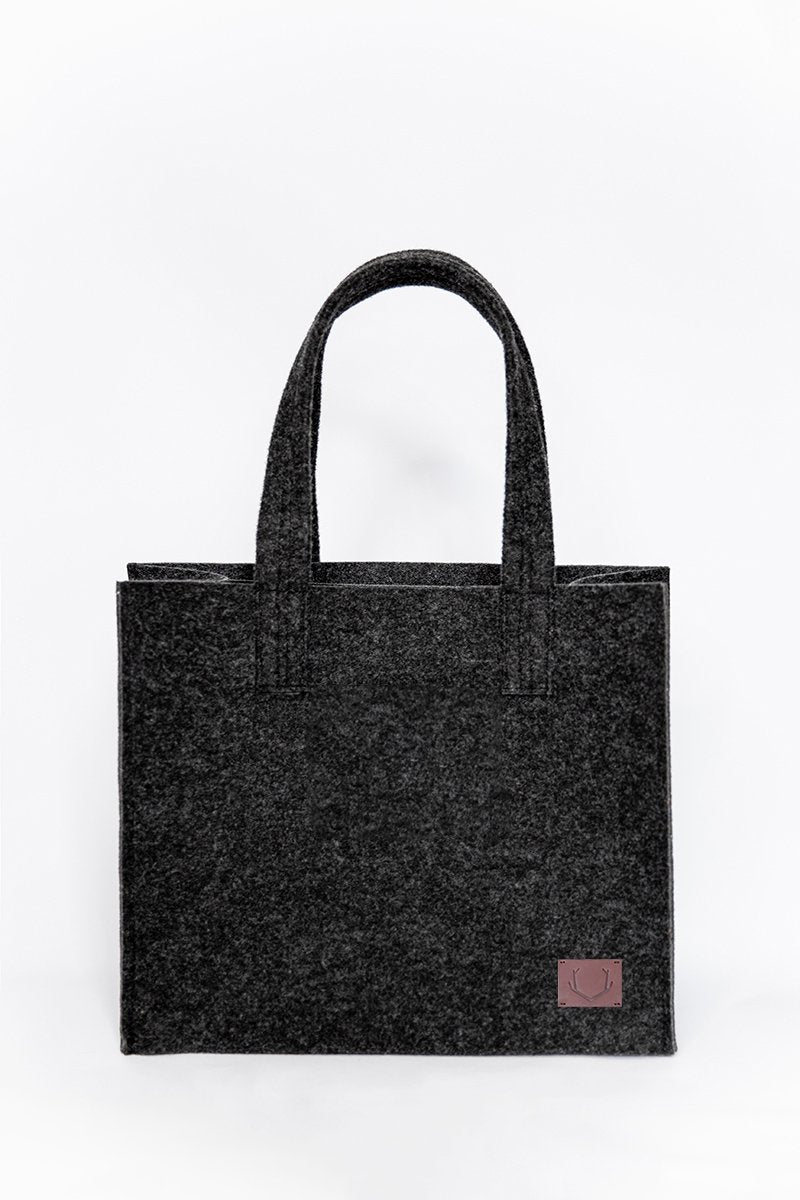 5. Studio shot of unisex black Office Bag Holm by Nordhale, featuring durable recycled PET felt material