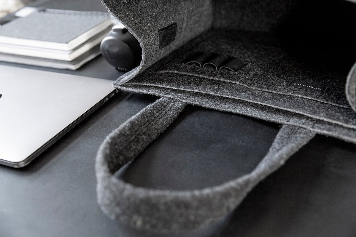 7. Close-up of black Office Bag Holm by Nordhale, highlighting interior organization with pen slots and laptop pocket