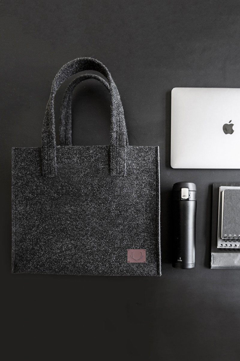 4. Unisex black Office Bag Holm by Nordhale with laptop and accessories, emphasizing organization and style