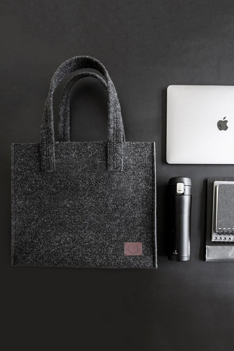 4. Unisex black Office Bag Holm by Nordhale with laptop and accessories, emphasizing organization and style