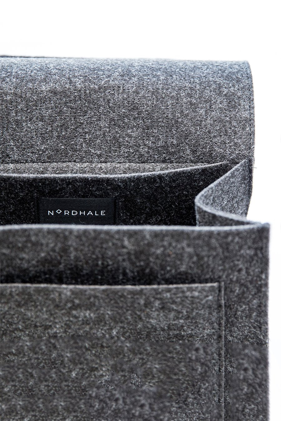 6. Close-up of Nordhale branding inside black Lund Mini Backpack