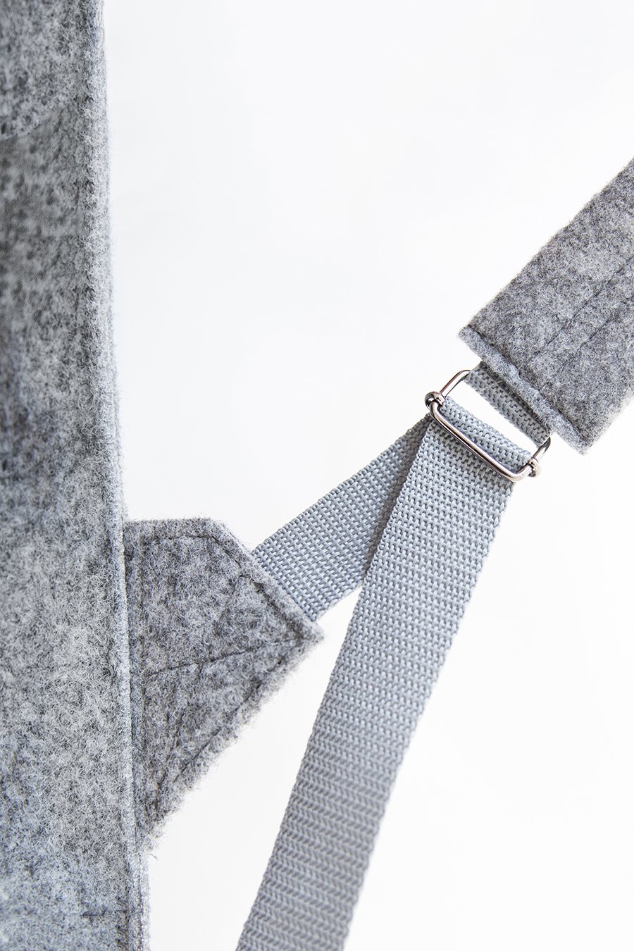 8. Close-up of Nordhale Backpack Lund in grey, focusing on magnetic snap closure
