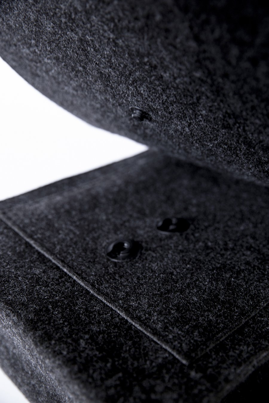8. Close-up of magnetic snaps on black Nordhale Backpack Lund