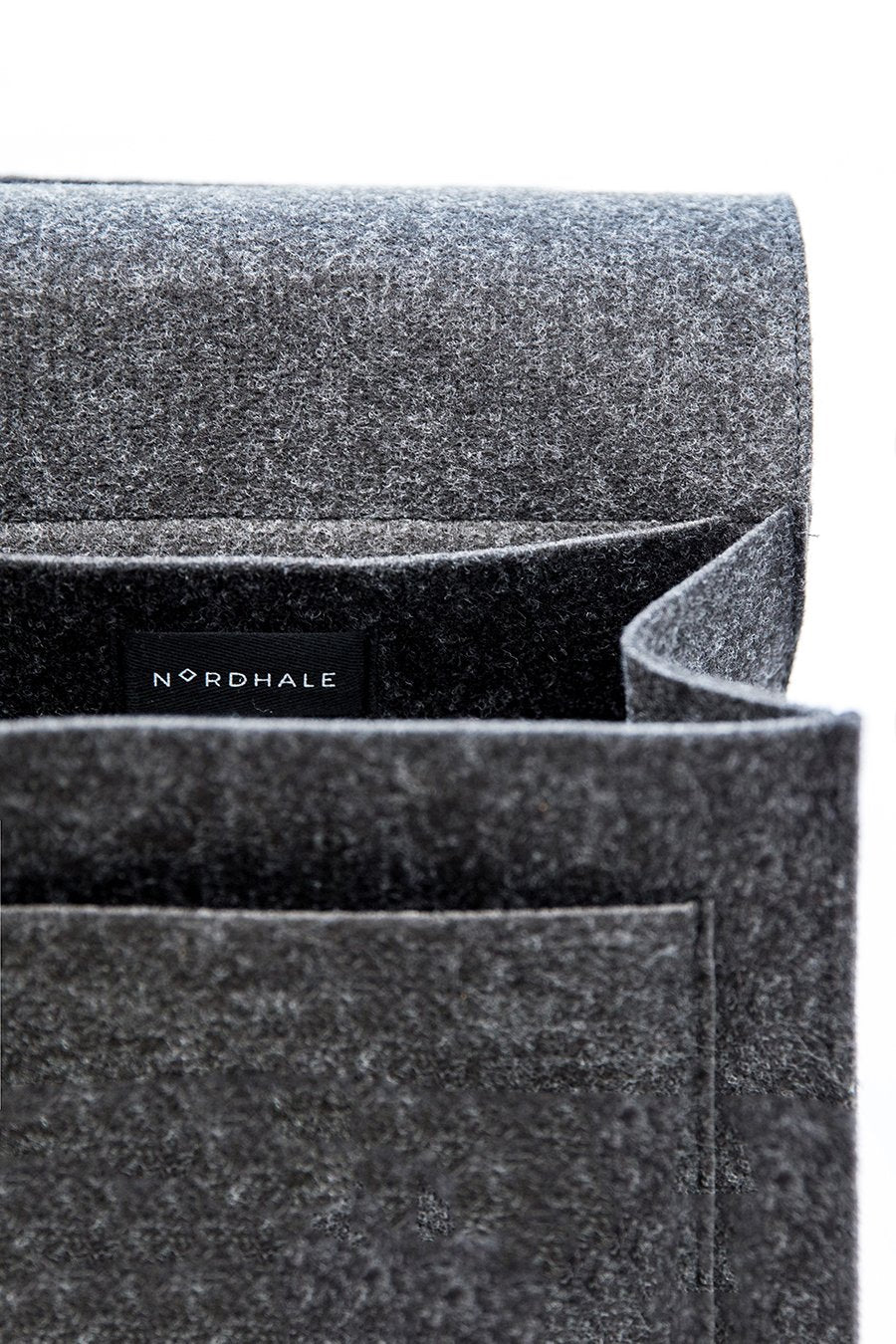 7. Close-up of Nordhale branding inside black Backpack Lund