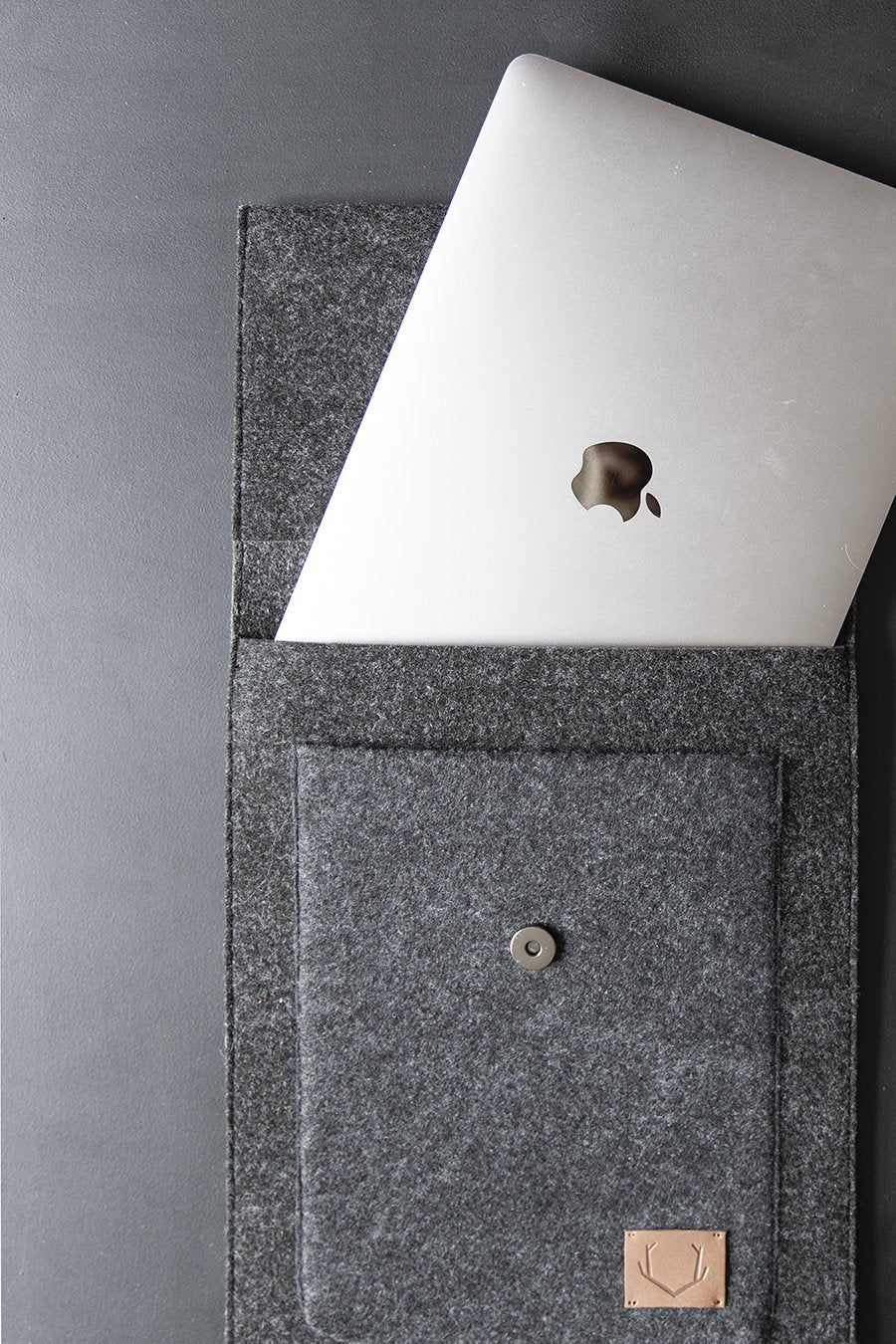 5. Open Nordhale Malmö Laptop Sleeve with MacBook partially inside, showcasing interior design