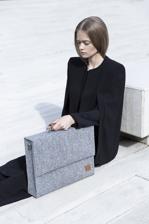 1. Two women with Nordhale grey Briefcase Sören, showcasing unisex design and minimalistic style