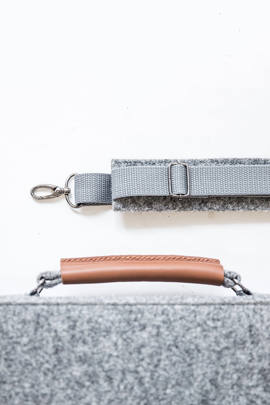 6. Close-up of Nordhale grey Briefcase Sören handle and detachable strap, highlighting craftsmanship