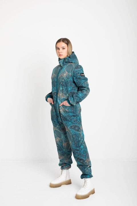1. Women's KARINA softshell overall by Nuckö in blue digital print, shown in studio setting