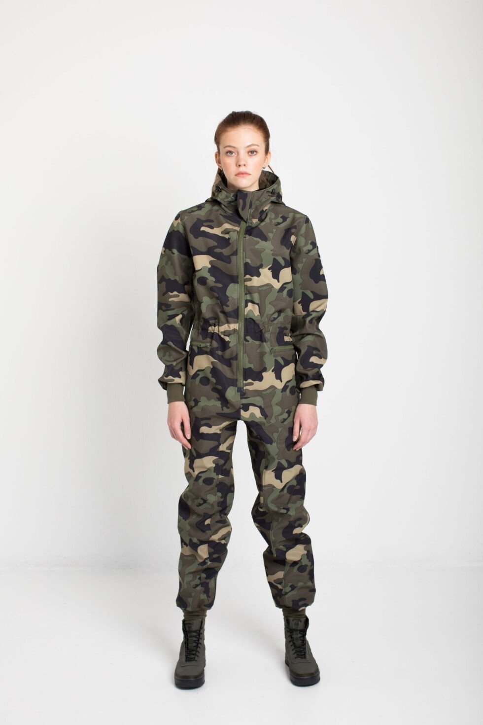 1. Women's SUSANNA softshell overall by Nuckö in camo print, front view in studio