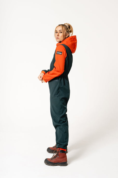 4. Women's Kristel softshell overall by Nuckö in dark green and orange, side view highlighting fit and design
