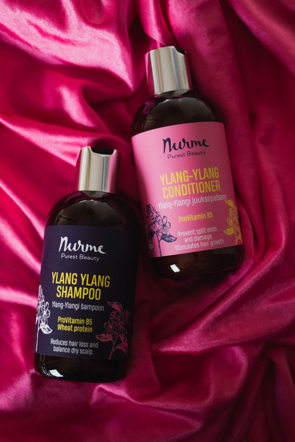 3. Nurme Ylang Ylang Shampoo and Conditioner bottles on pink fabric background