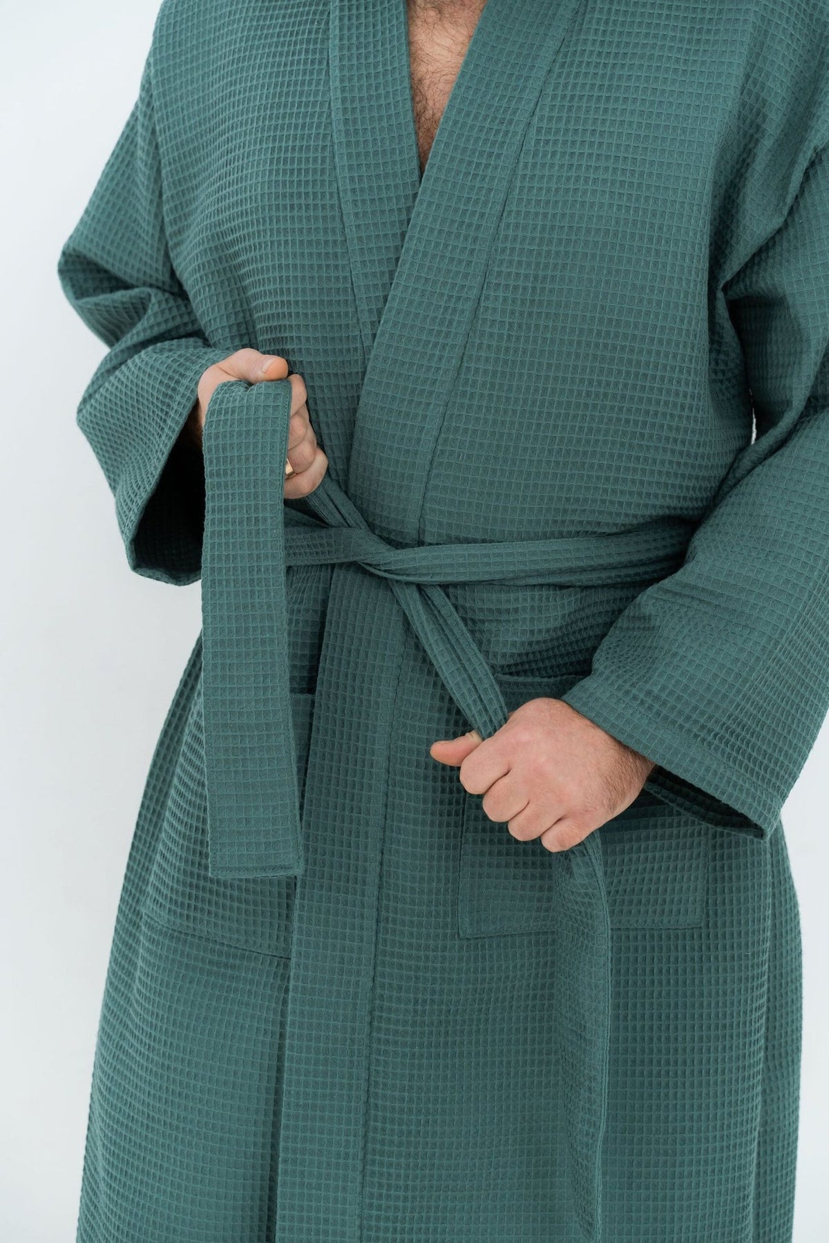 3. Close-up of green waffle robe showing belt and pocket detail