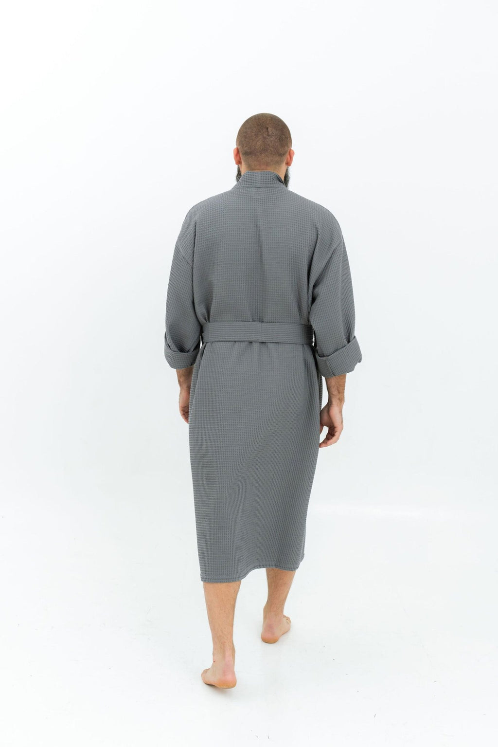 9. Man wearing grey waffle fabric robe with belt shown from back on white background