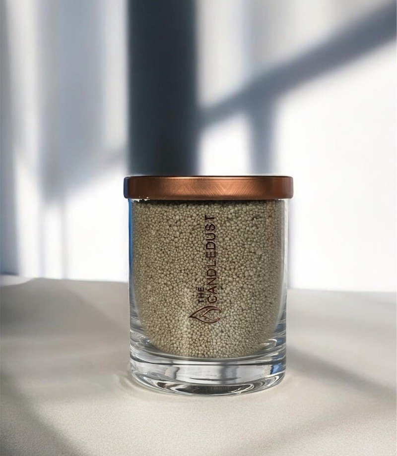 2. Unscented olive green powder candle by Candledust with copper lid in glass, studio shot