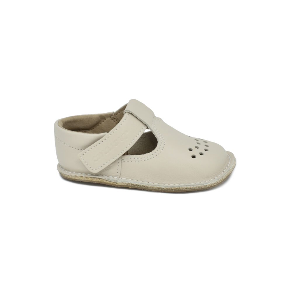 2. Studio shot of a single Omaking Lusti natural white leather kids' shoe with Velcro fastener
