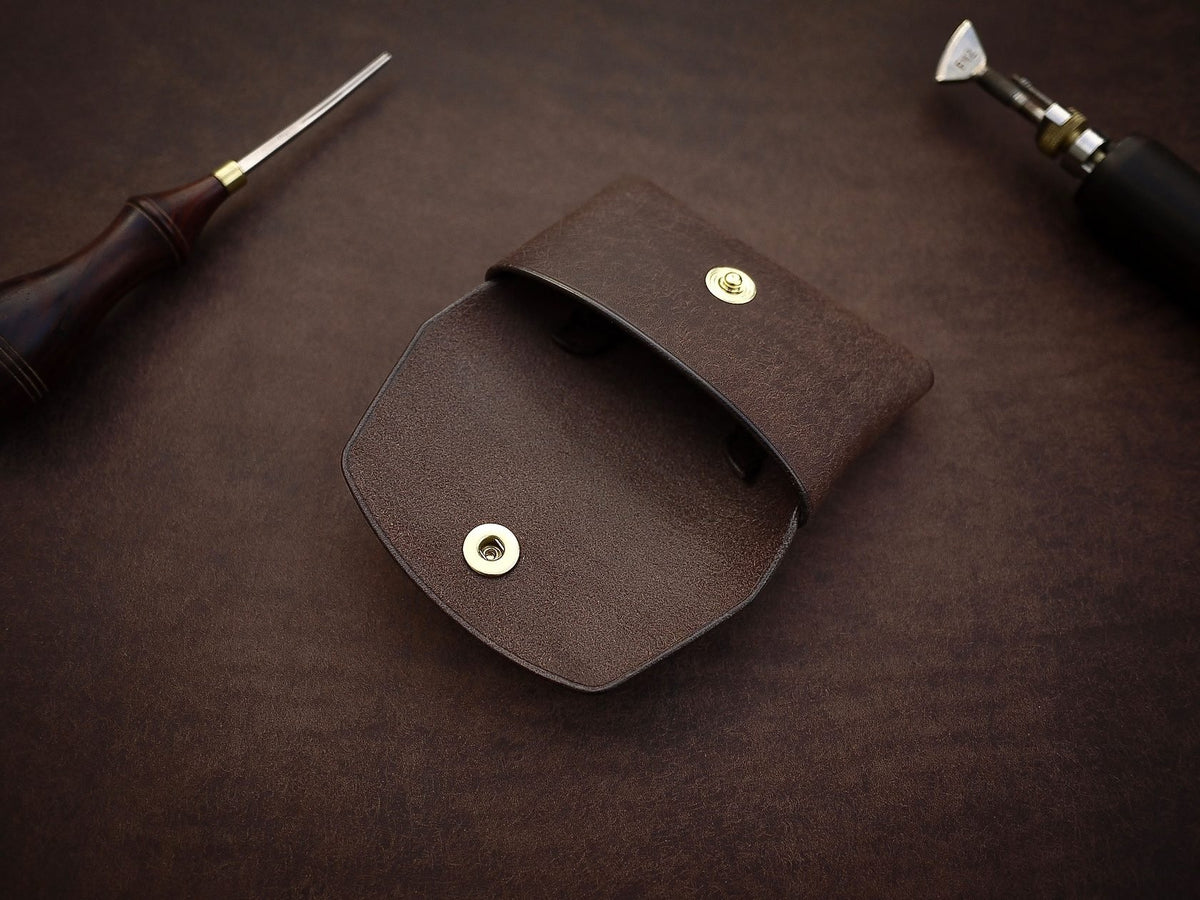 4. Open view of Mirgoods dark brown button leather wallet, showing interior and brass snap closure