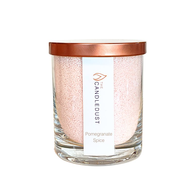 1. Candledust Pomegranate Spice powdered candle in glass with rose gold lid, studio shot