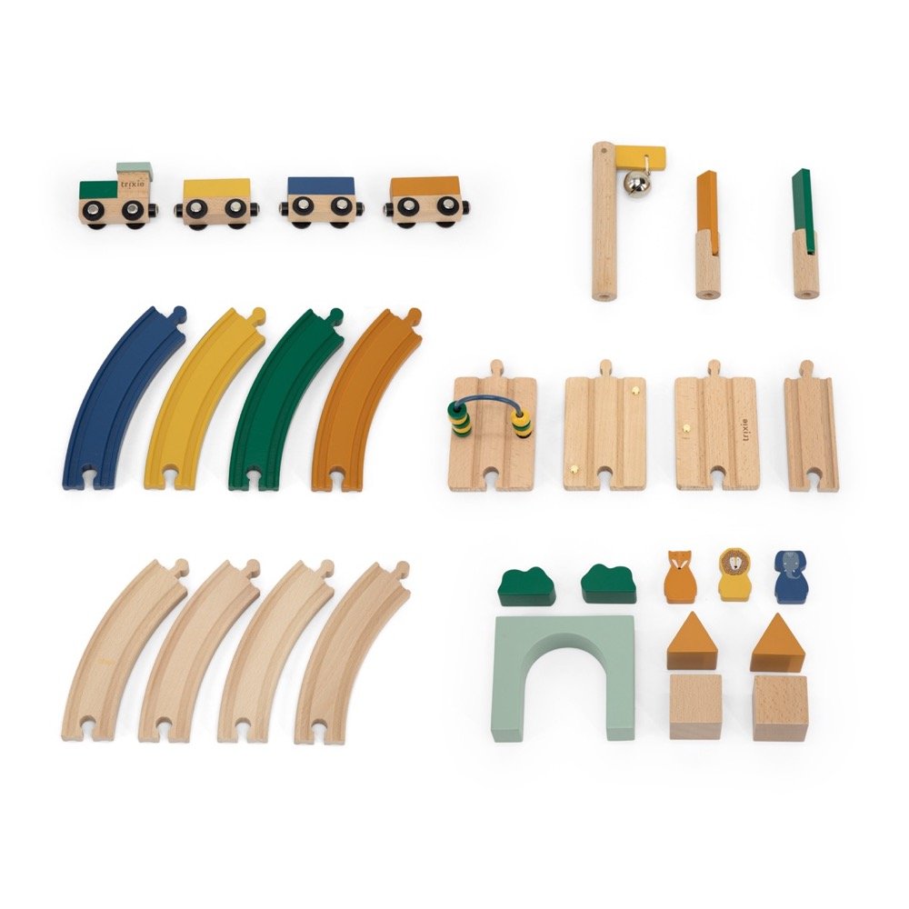 4. Flat lay of Trixie Baby Wooden Railway Set components including tracks, locomotive, wagons, and accessories