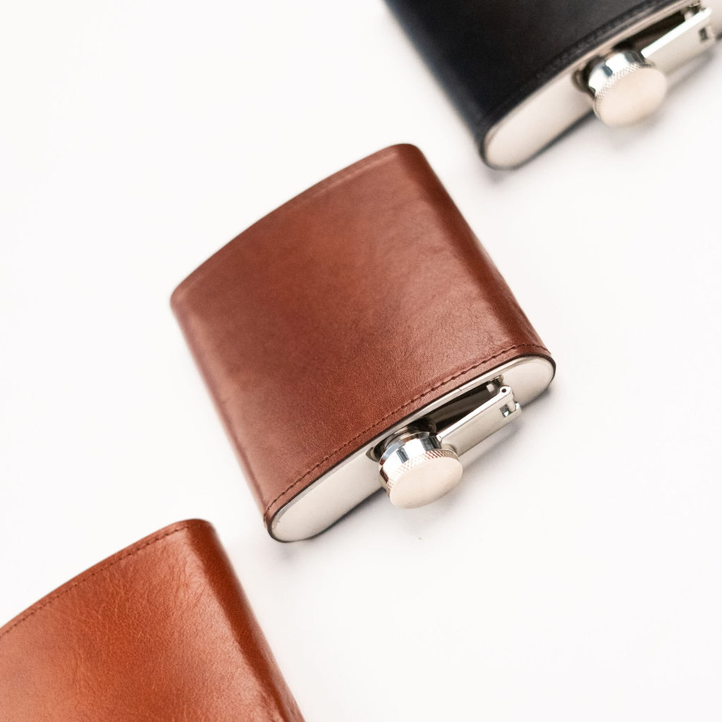 4. Close-up of Papillon Hip Flask No. 21 in brown leather, showing stainless steel cap