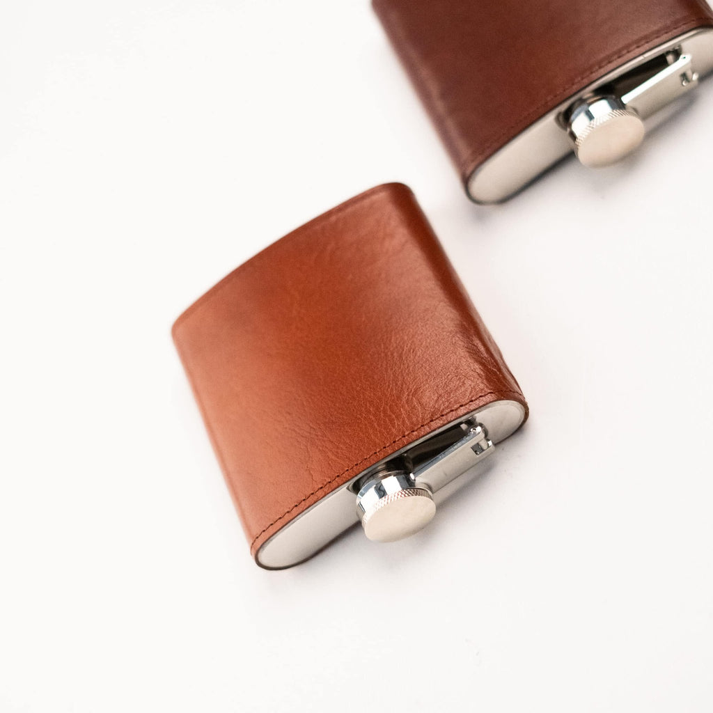 5. Close-up of Papillon Hip Flask No. 21 in tan leather, featuring stainless steel cap