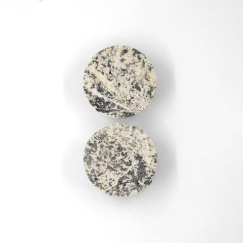 4. Flat lay of Seif Design Orbit KOHEV LUMI earrings in slate and marble showing circular shape and texture