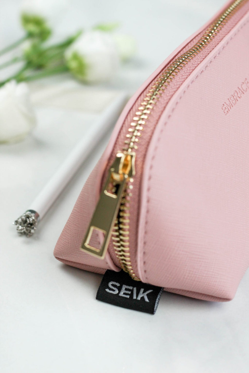 3. Detail of SEIK pink pencil case with gold zipper and brand tag