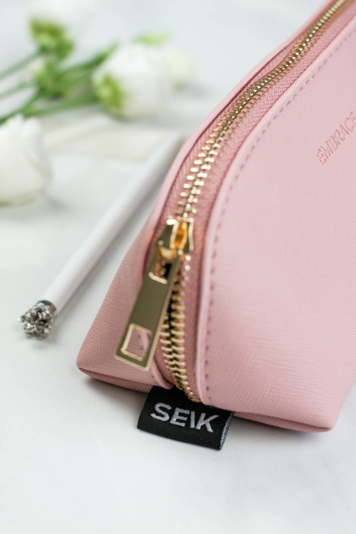3. Detail of SEIK pink pencil case with gold zipper and brand tag