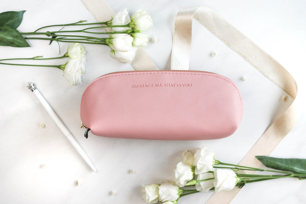 1. SEIK pink pencil case with 'EMBRACE ALL THAT IS YOU' text, surrounded by white flowers and ribbon