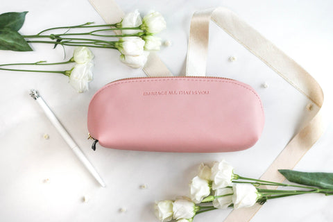 1. SEIK pink pencil case with 'EMBRACE ALL THAT IS YOU' text, surrounded by white flowers and ribbon