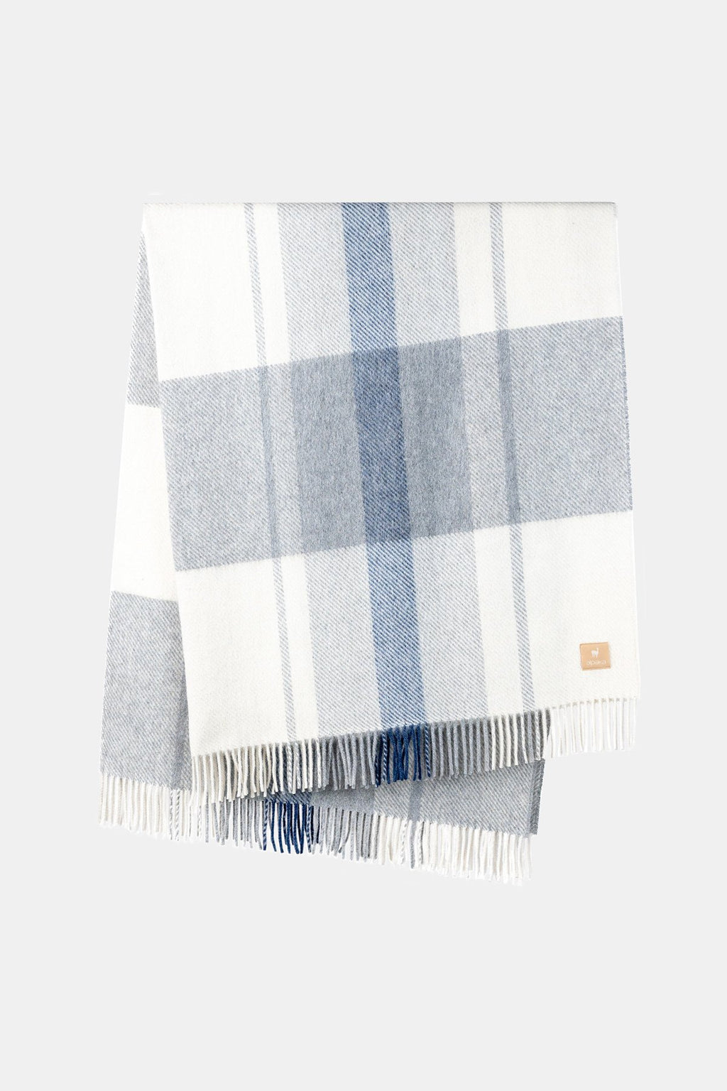 2. Alpaka Natural Alpaca Wool Throw in Blue/Silver, displayed in a studio setting