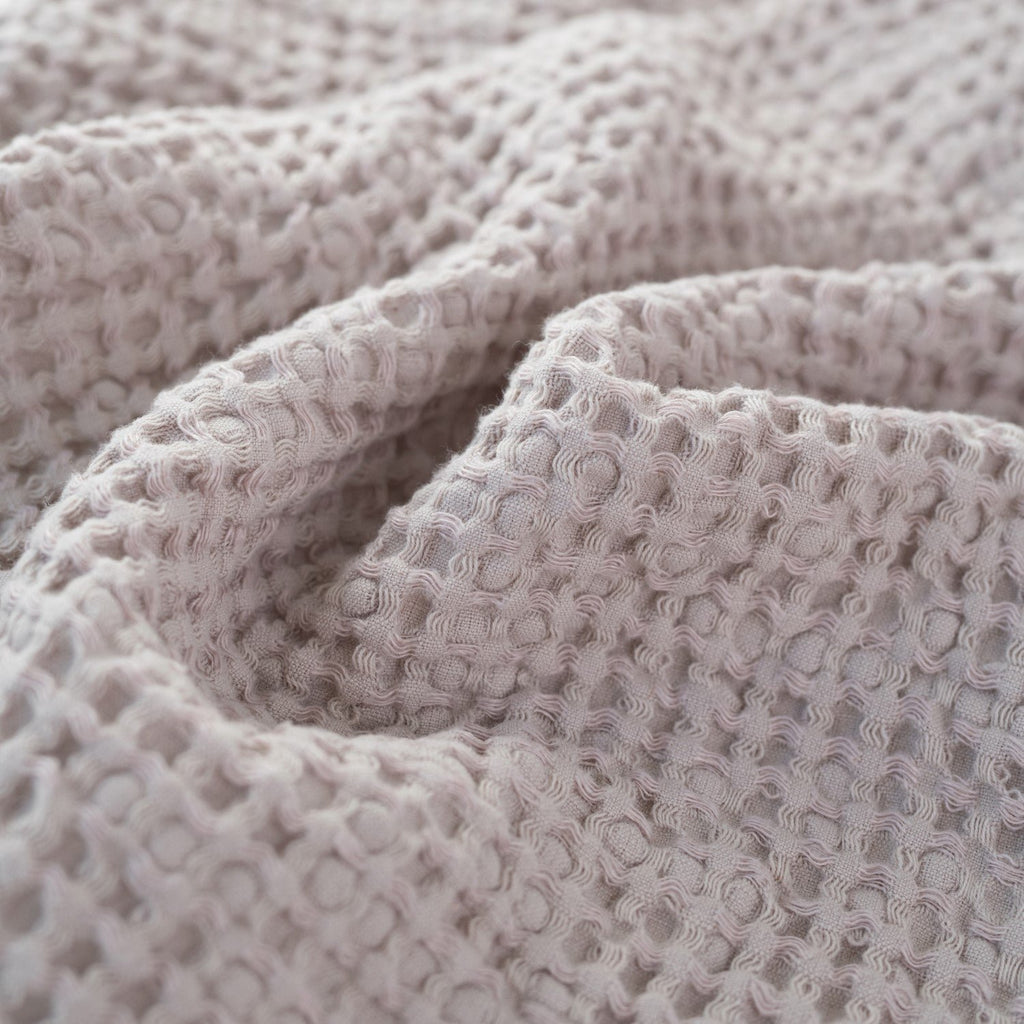 4. Detailed view of powder-colored honeycomb waffle fabric texture, highlighting weave and softness