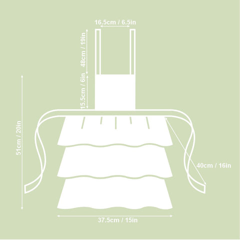 4. Size chart for Botanico Kids Apron by Hortensias Home, showing dimensions in centimeters and inches