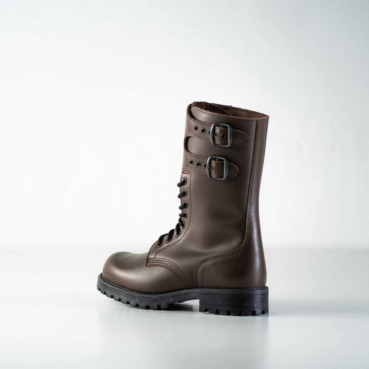 2. Side view of unisex Tarkovsky Boots in dark brown leather, featuring lace-up design and buckle straps