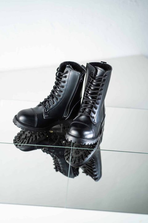 5. Unisex black 511 Winter boots by Samelin with open zipper, displayed on reflective surface
