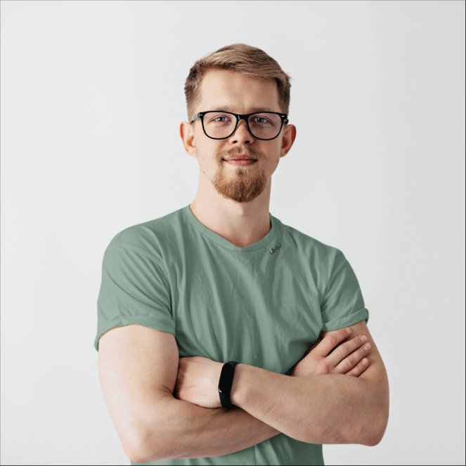1. Unisex green organic cotton T-shirt by Beebila worn by male model, showcasing embroidered collar in studio setting