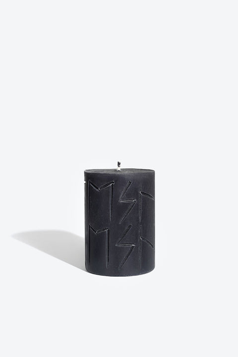 1. Smells Like Spells Rune Candle HEL in black soy wax with rune carvings, studio shot