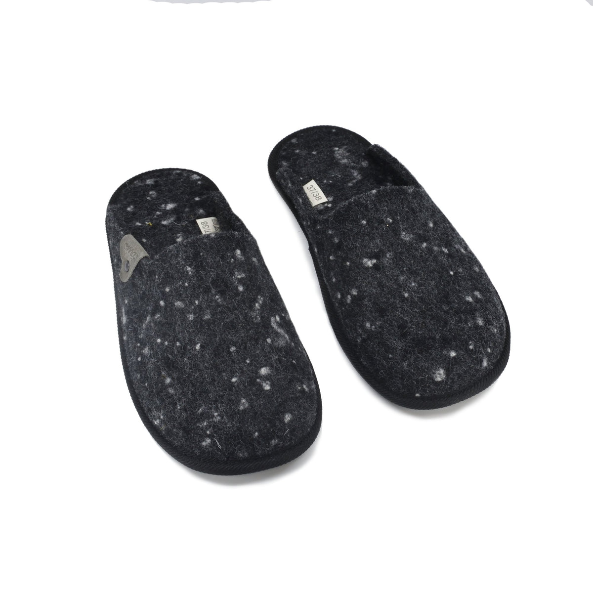 4. Studio image of Omaking dark grey felt slippers with visible brand label
