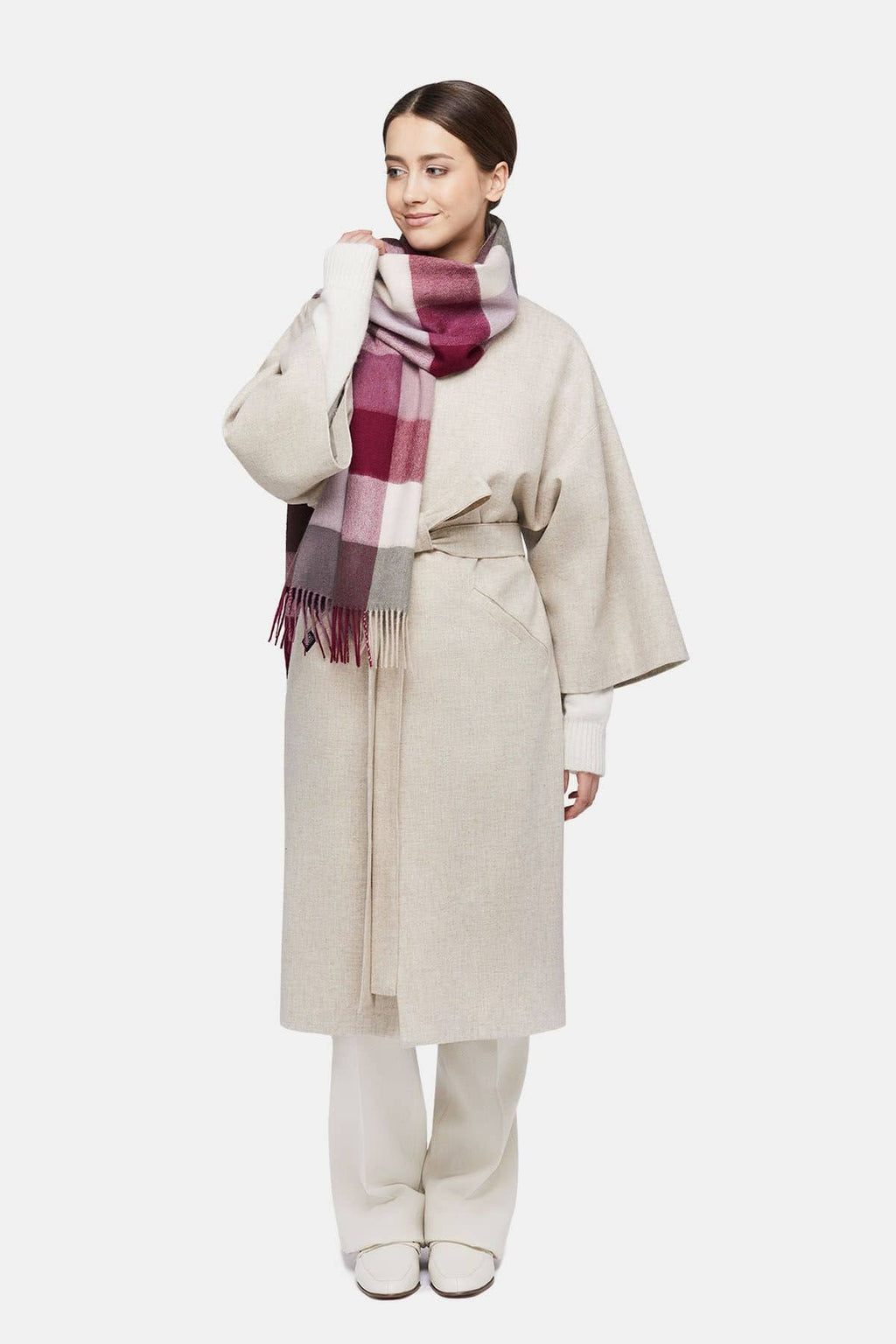 1. Women's natural baby alpaca wool check scarf in pink and white, worn by model in lifestyle setting