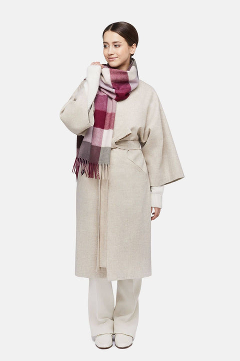 1. Women's natural baby alpaca wool check scarf in pink and white, worn by model in lifestyle setting