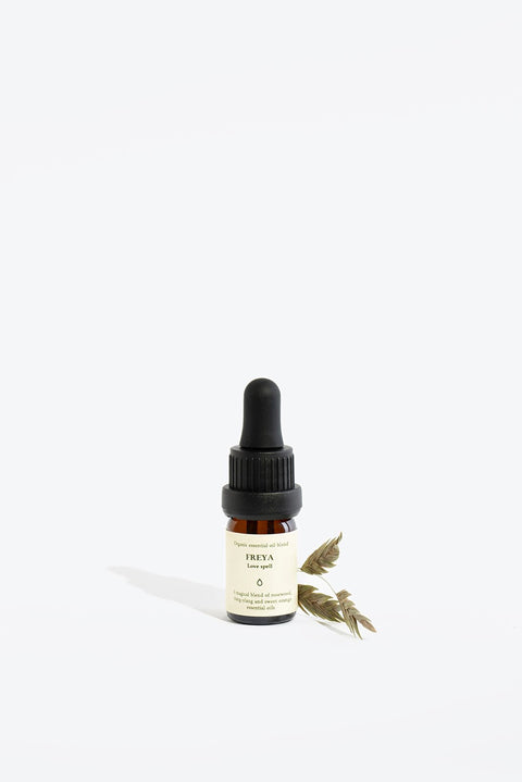 2. Smells Like Spells FREYA essential oil blend in 5 ml glass bottle with pipette, styled with dried leaves