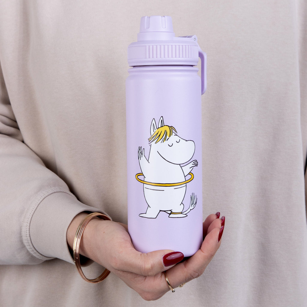 1. Snorkmaiden Thermal Everyday Bottle by Moomin held by a person, showcasing the playful design and practical handle