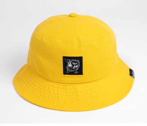 4. Close-up of Moomin character patch on yellow Stinky Bucket Hat