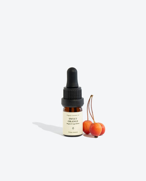 1. Smells Like Spells SWEET ORANGE Essential Oil in 5 ml glass bottle with pipette, styled with small orange fruits