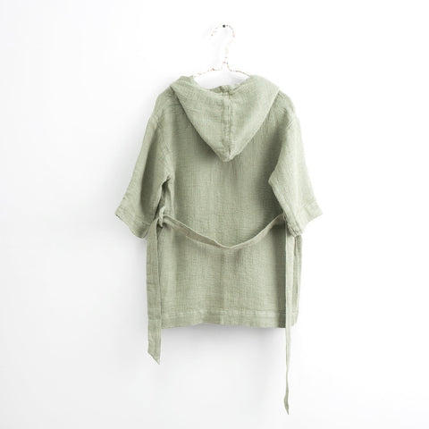 2. Back view of kids sage green linen bathrobe with hood and tie belt hanging on white background