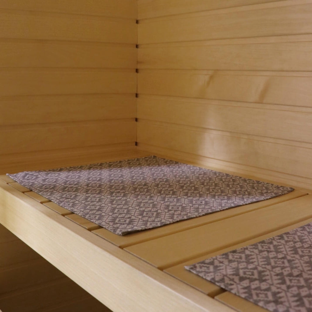 2. Sauna bench with two LOKO seating pads showcasing traditional Harju County mitten pattern