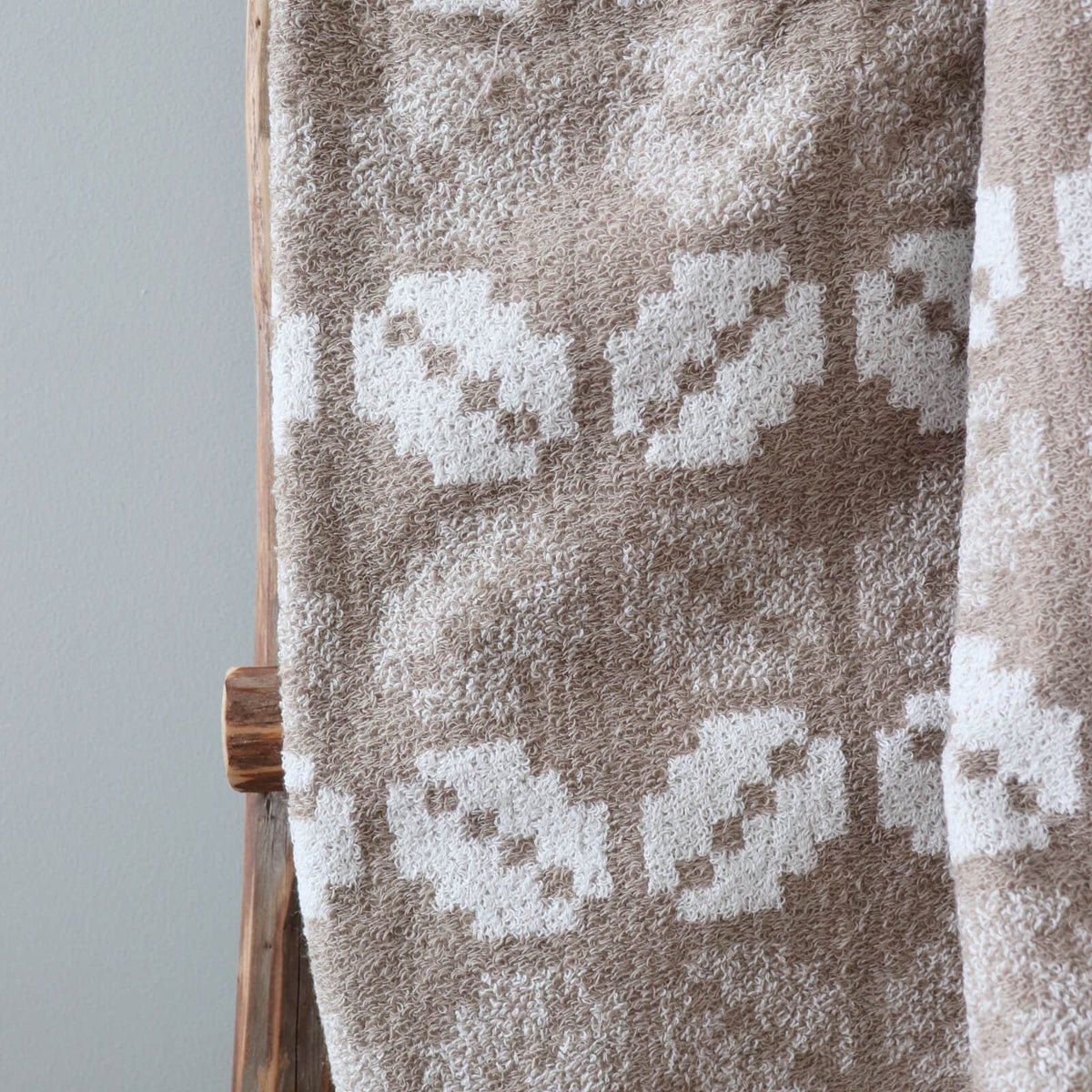 3. Close-up of beige terry sauna towel showing Lääne County mitten pattern texture