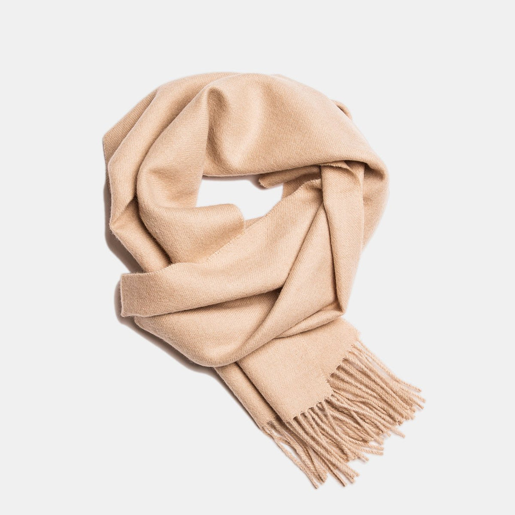 2. Beige Alpaka baby alpaca wool scarf with fringe detail in flat lay